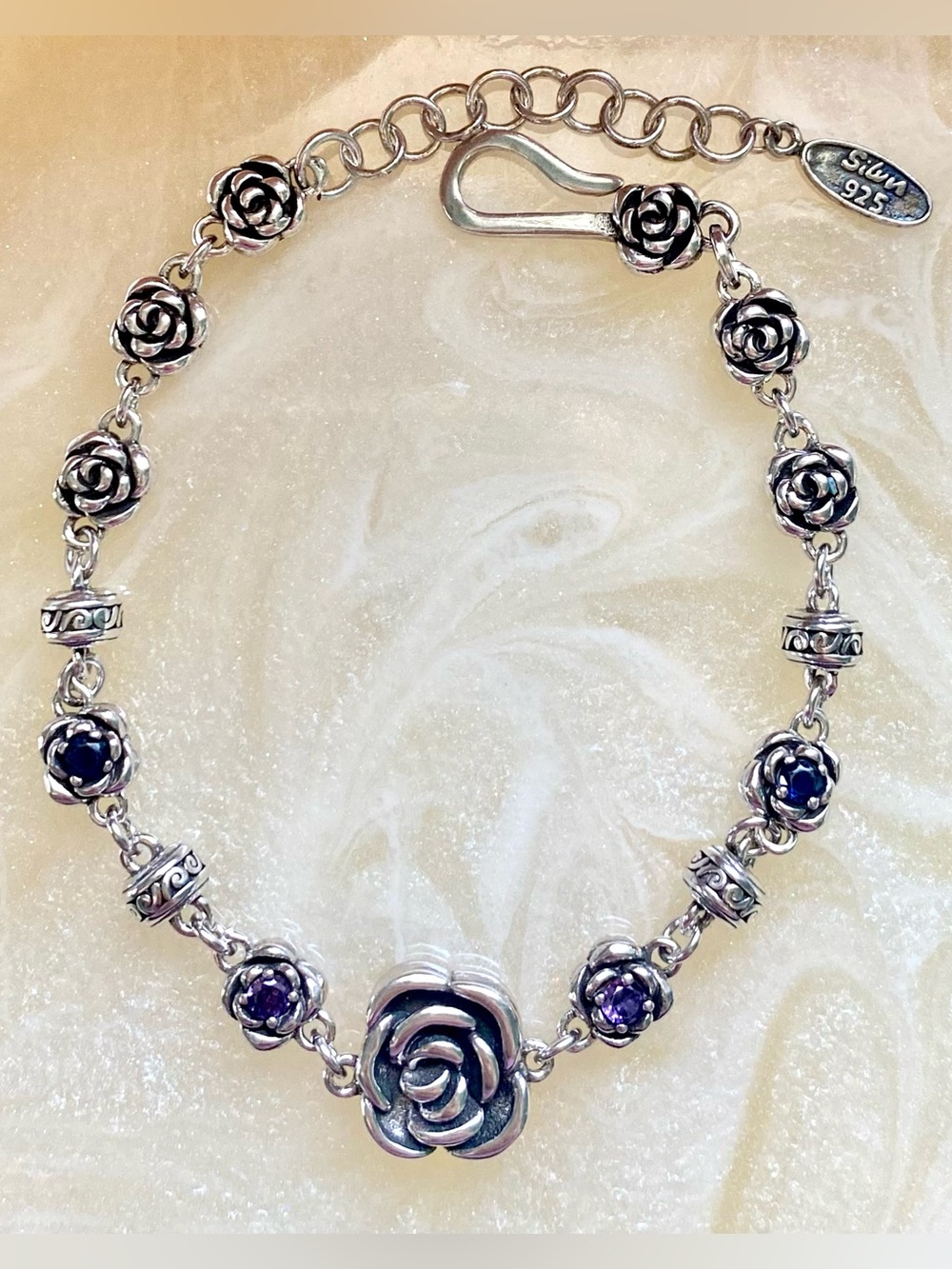 Sterling Silver Rose Bracelet with Purple Gem Accents